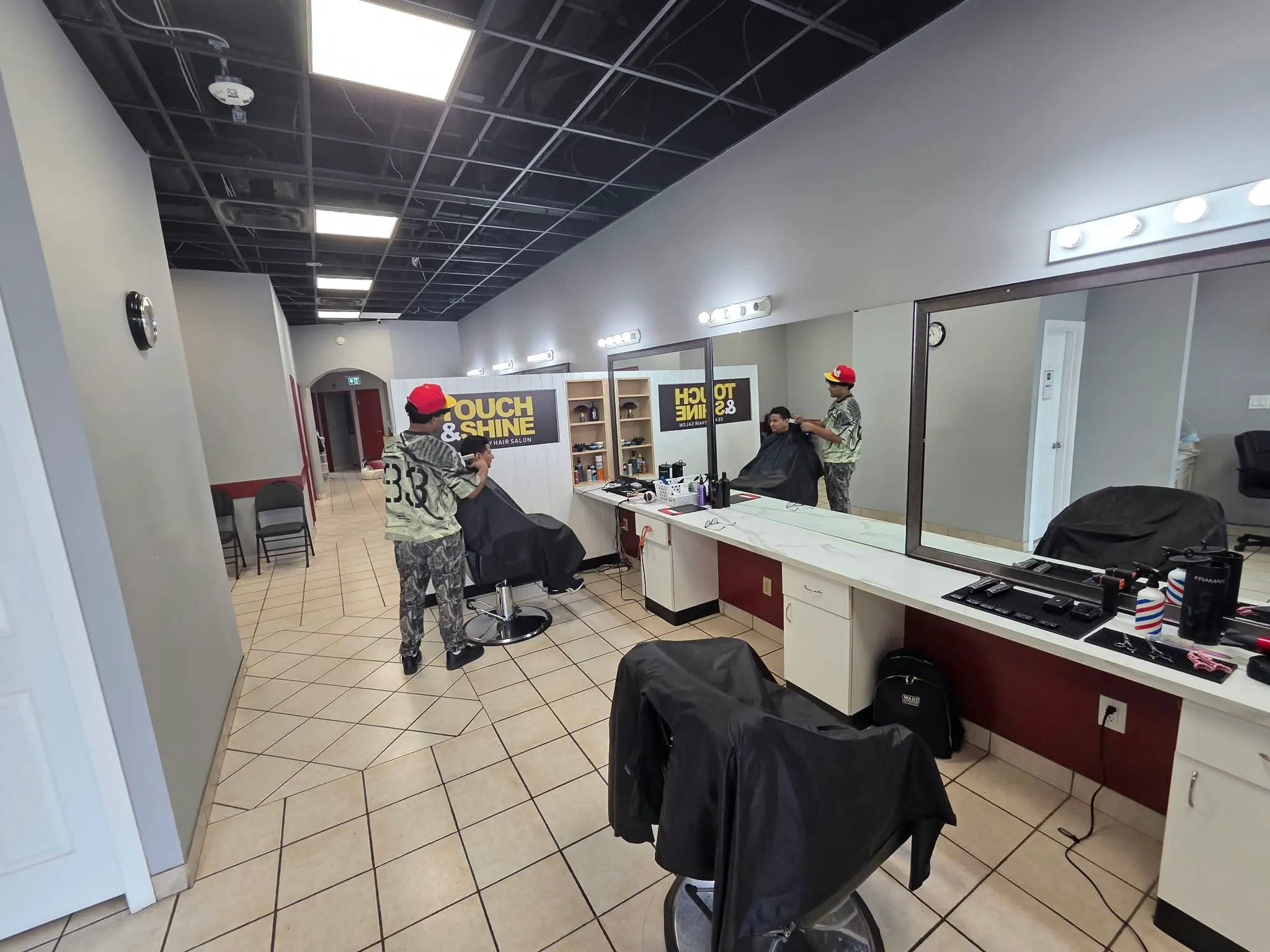 Styling stations and barber chairs inside Touch & Shine